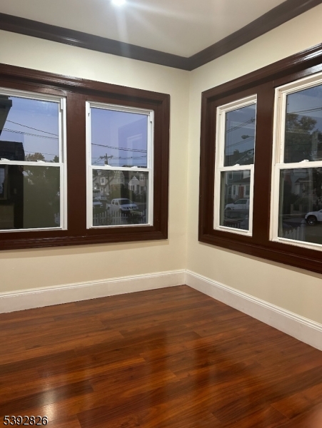 904 Cross Elizabeth, NJ 07208 - Photo 6 of 27 a view of lot of windows with wooden floor