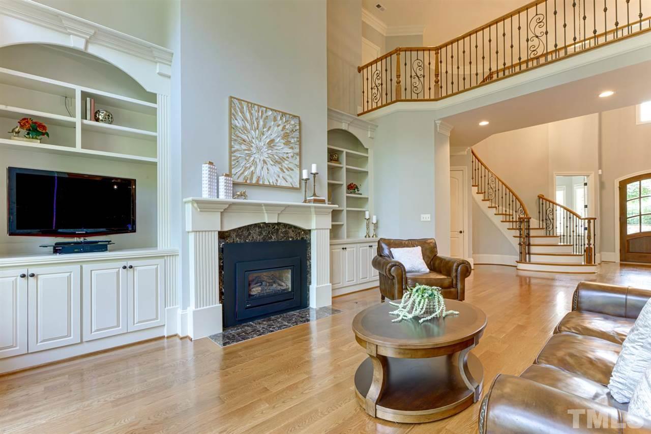 1317 Caistor Lane Raleigh, NC 27614 - Photo 21 of 22 Bright open floor plan-with GLEAMING HARDWOODS! Open to the entry and kitchen/breakfast area, this is one of the 3 FIREPLACES! The interior was freshly painted - MOVE IN READY!!