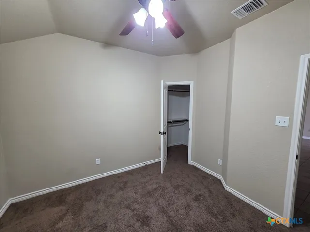 a view of an empty room and a windows