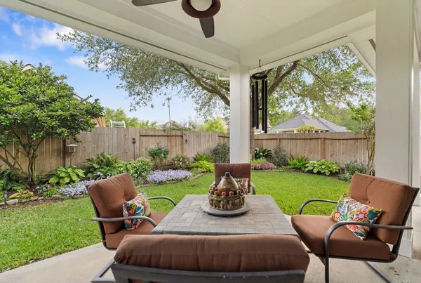 a bathroom with a sink a toilet and shower curtain