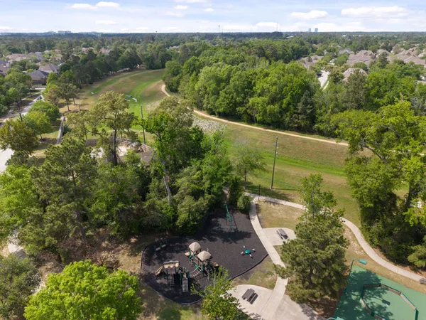 a view of backyard with house and green space