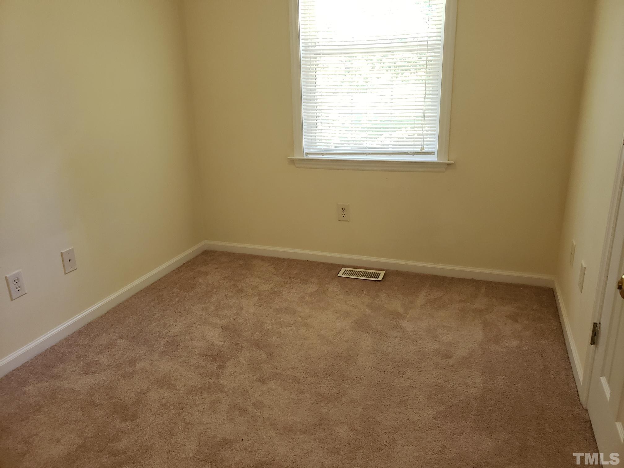 542 Barnes Lake Road, Unit B Middlesex, NC 27557 - Photo 14 of 16 an empty room with a window