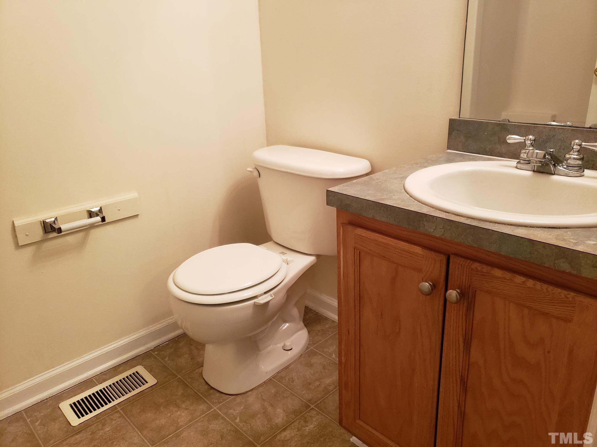 542 Barnes Lake Road, Unit B Middlesex, NC 27557 - Photo 6 of 16 a bathroom with a toilet sink and mirror