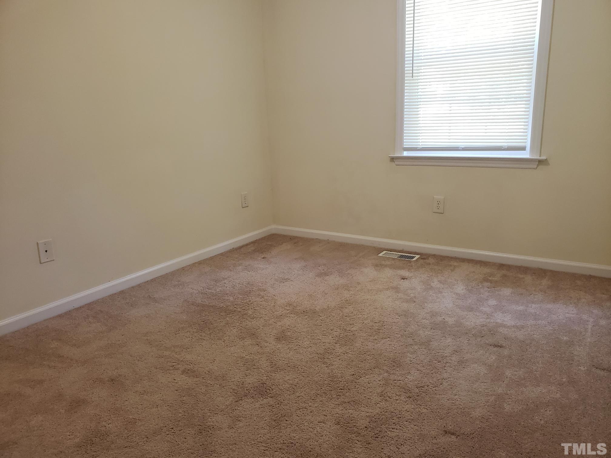 542 Barnes Lake Road, Unit B Middlesex, NC 27557 - Photo 7 of 16 an empty room with a window