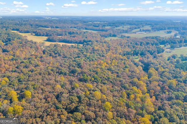 a view of residential space with wooden fence