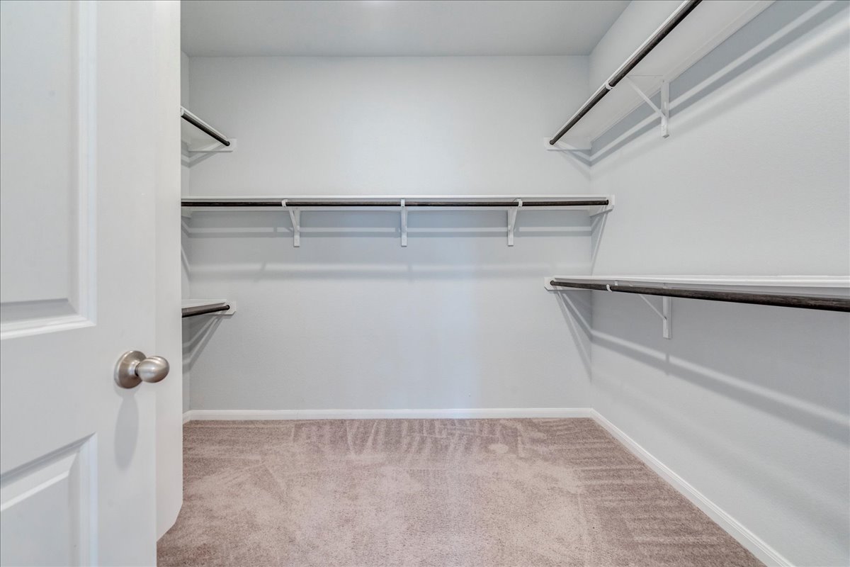 275 Cherrystone Loop Buda, TX 78610 - Photo 21 of 33 Primary suite closet (the size of a small bedroom)