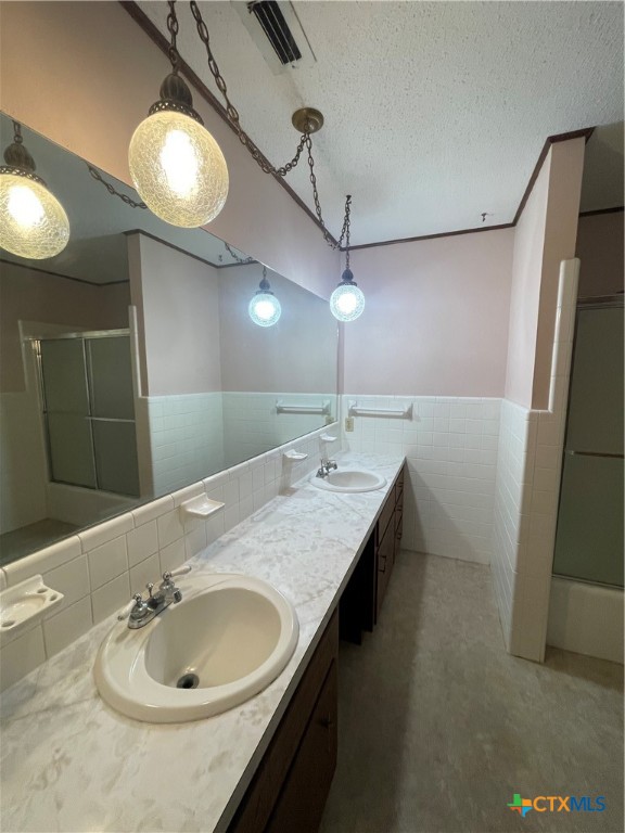 508 Tower Street Killeen, TX 76541 - Photo 3 of 12 a bathroom with a granite countertop sink a mirror and vanity