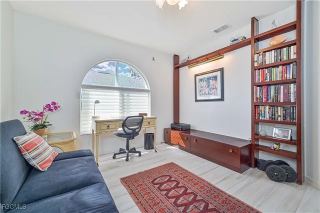 a living room with furniture or window and a table