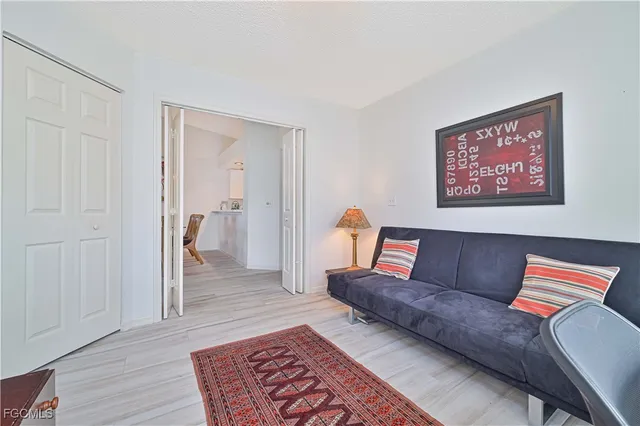 a living room with furniture and a rug
