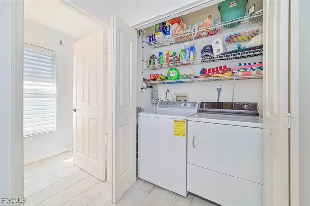 a bathroom with a sink a toilet and a window