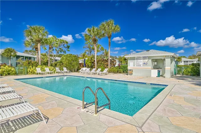 a view of a lake with a house in the background