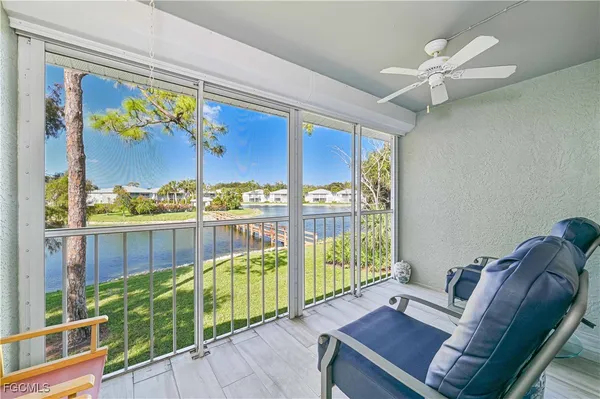 a view of a living room and a floor to ceiling window