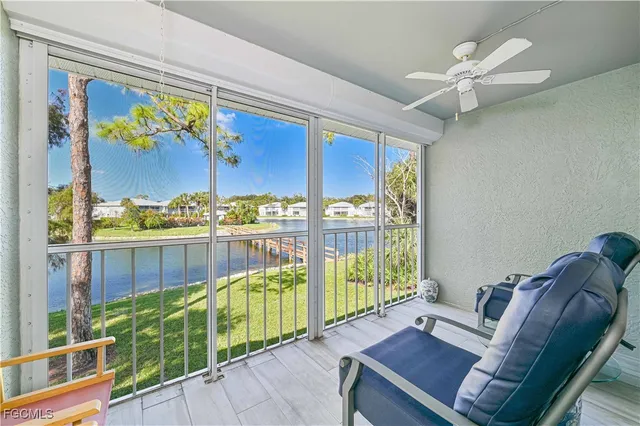 a view of a living room and a floor to ceiling window