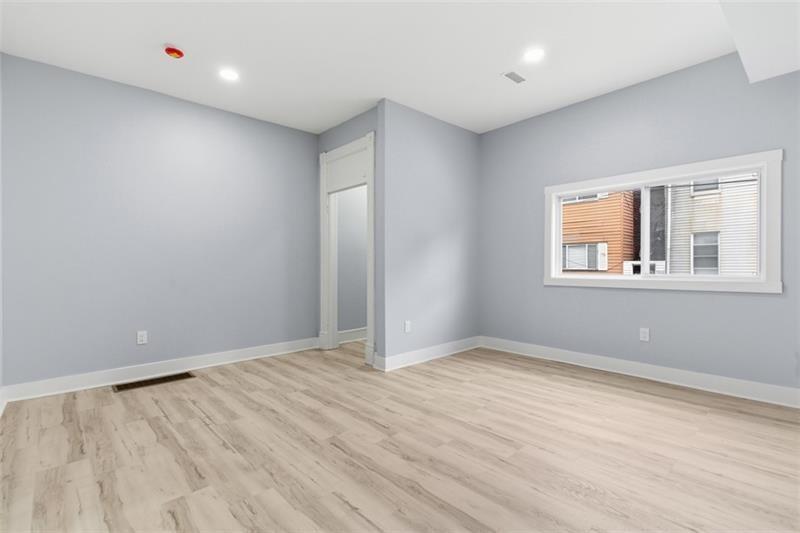 1150 Goettmann Street Pittsburgh, PA 15212 - Photo 11 of 36 a view of empty room with wooden floor and fan