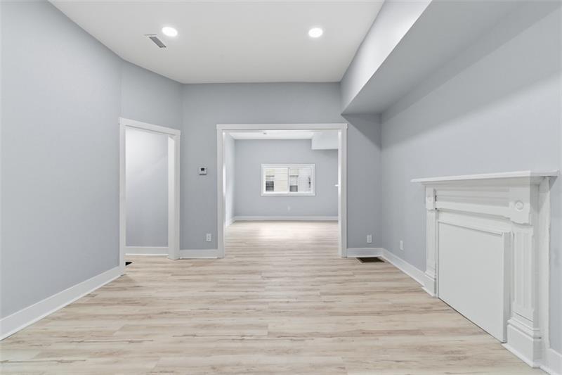 1150 Goettmann Street Pittsburgh, PA 15212 - Photo 15 of 36 an empty room with wooden floor and windows