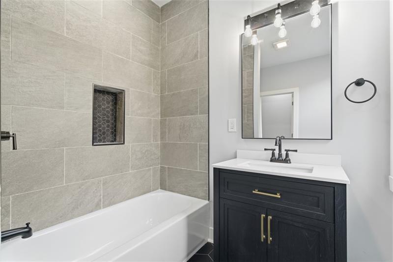 1150 Goettmann Street Pittsburgh, PA 15212 - Photo 19 of 36 a bathroom with a bathtub and a sink