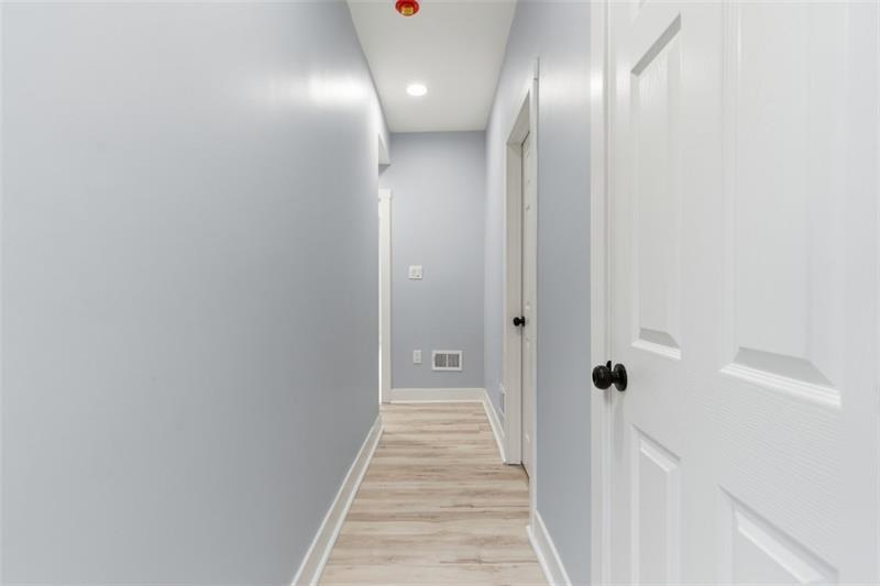 1150 Goettmann Street Pittsburgh, PA 15212 - Photo 22 of 36 a view of a hallway with wooden floor