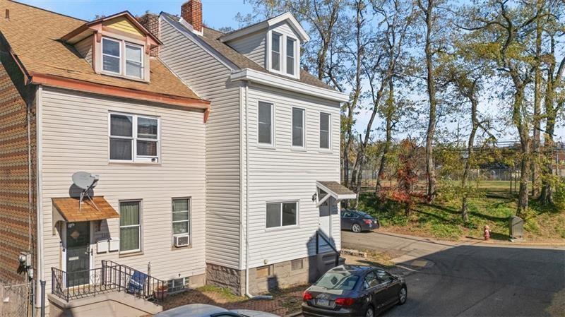 1150 Goettmann Street Pittsburgh, PA 15212 - Photo 33 of 36 a front view of a house with a yard