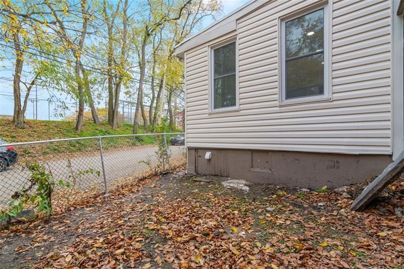 1150 Goettmann Street Pittsburgh, PA 15212 - Photo 35 of 36 a view of a backyard with plants and tree