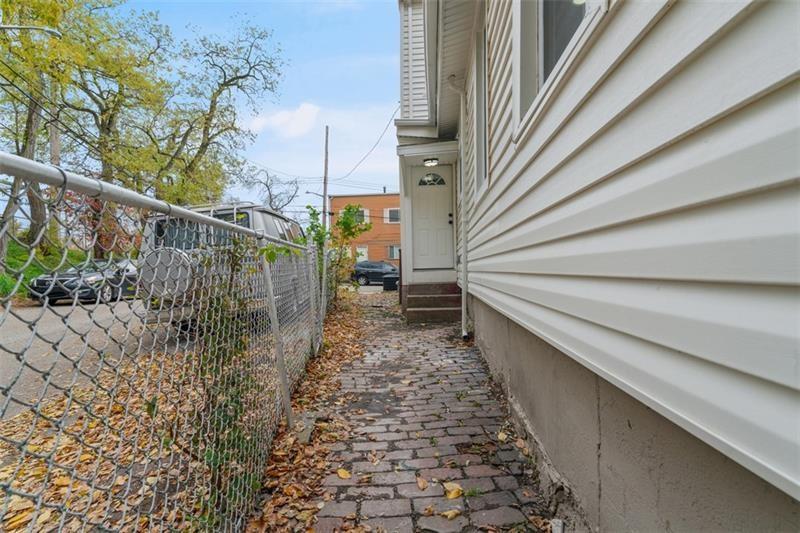 1150 Goettmann Street Pittsburgh, PA 15212 - Photo 36 of 36 a backyard of a house with lots of green space