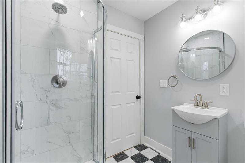 1150 Goettmann Street Pittsburgh, PA 15212 - Photo 7 of 36 a bathroom with a sink and mirror