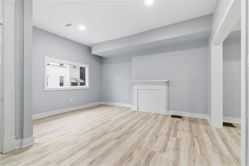 1150 Goettmann Street Pittsburgh, PA 15212 - Photo 9 of 36 a view of empty room with wooden floor and fan