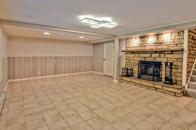 a view of an empty room with a fireplace