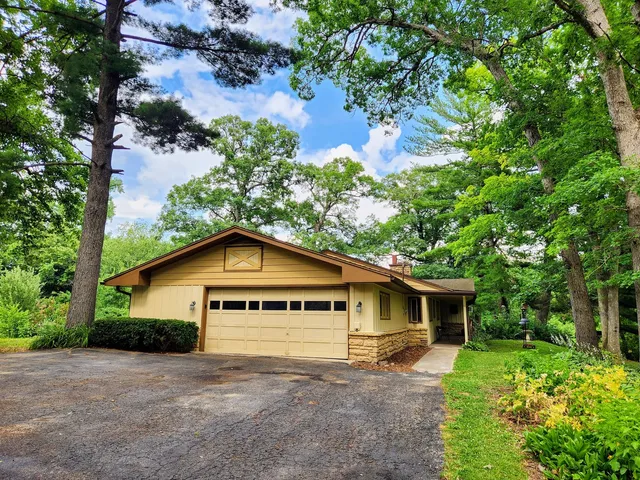 a house with trees in the background