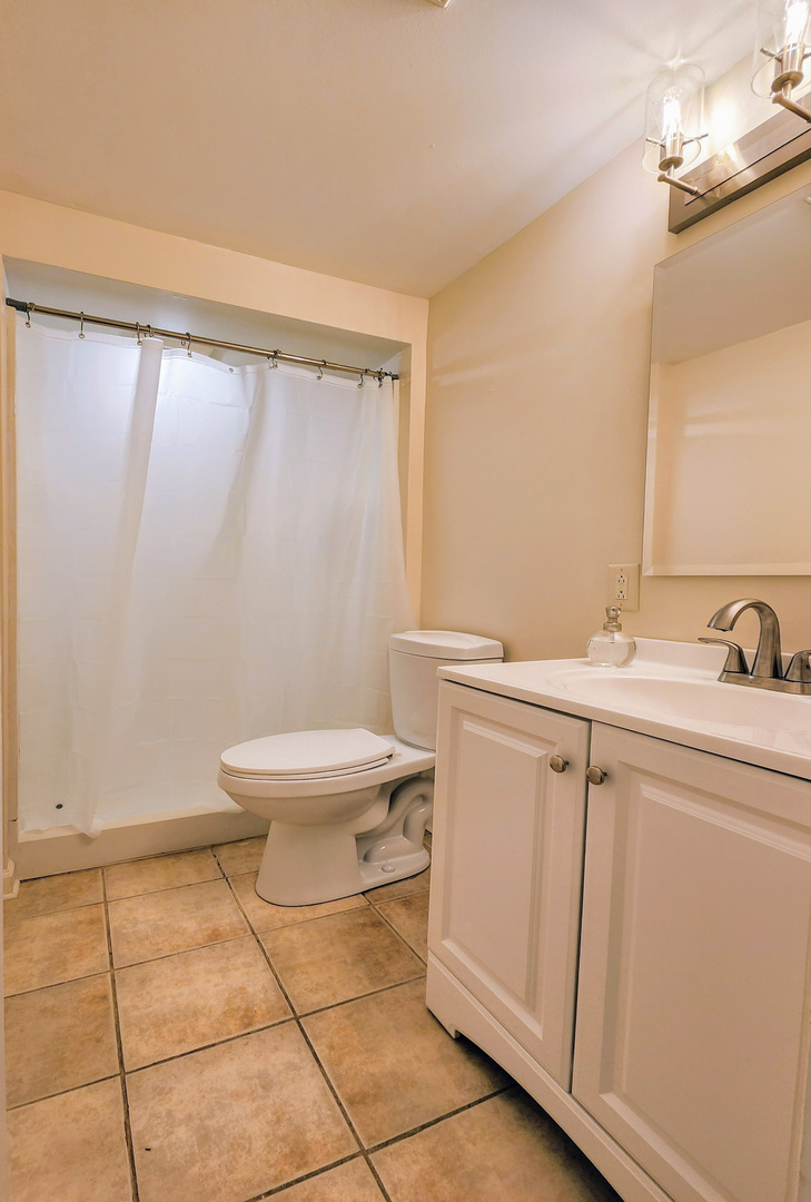 20798 White Oaks Road Morrison, IL 61270 - Photo 34 of 48 a bathroom with a sink a toilet and a mirror