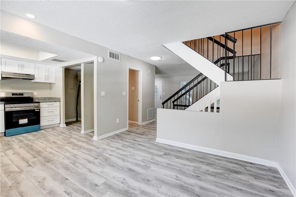 7325 Cardigan Circle Atlanta, GA 30328 - Photo 11 of 25 a view of a hallway with kitchen and entryway