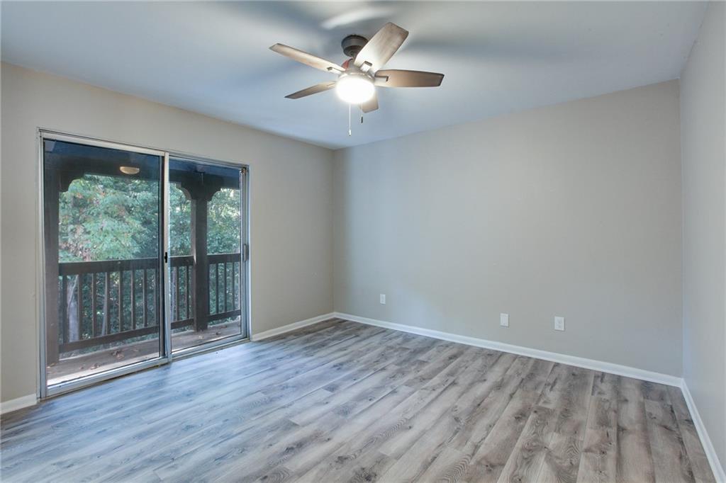 7325 Cardigan Circle Atlanta, GA 30328 - Photo 16 of 25 wooden floor in an empty room with a window