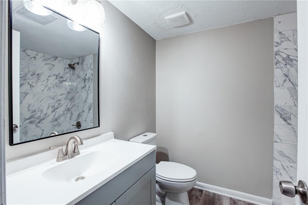 7325 Cardigan Circle Atlanta, GA 30328 - Photo 17 of 25 a bathroom with a sink and a toilet