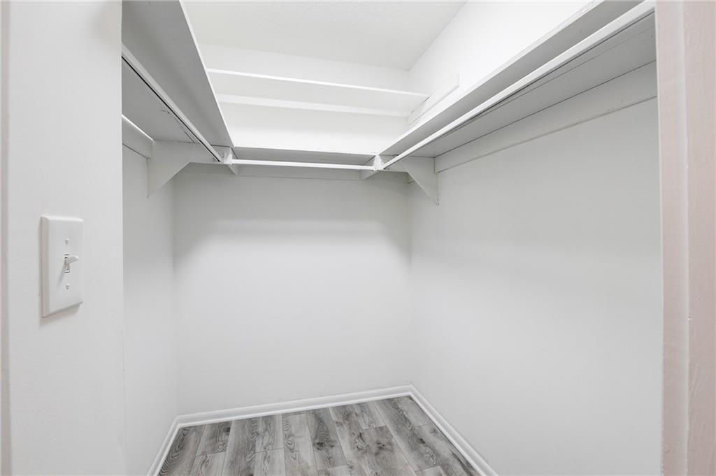 7325 Cardigan Circle Atlanta, GA 30328 - Photo 20 of 25 a view of walk in closet with empty racks