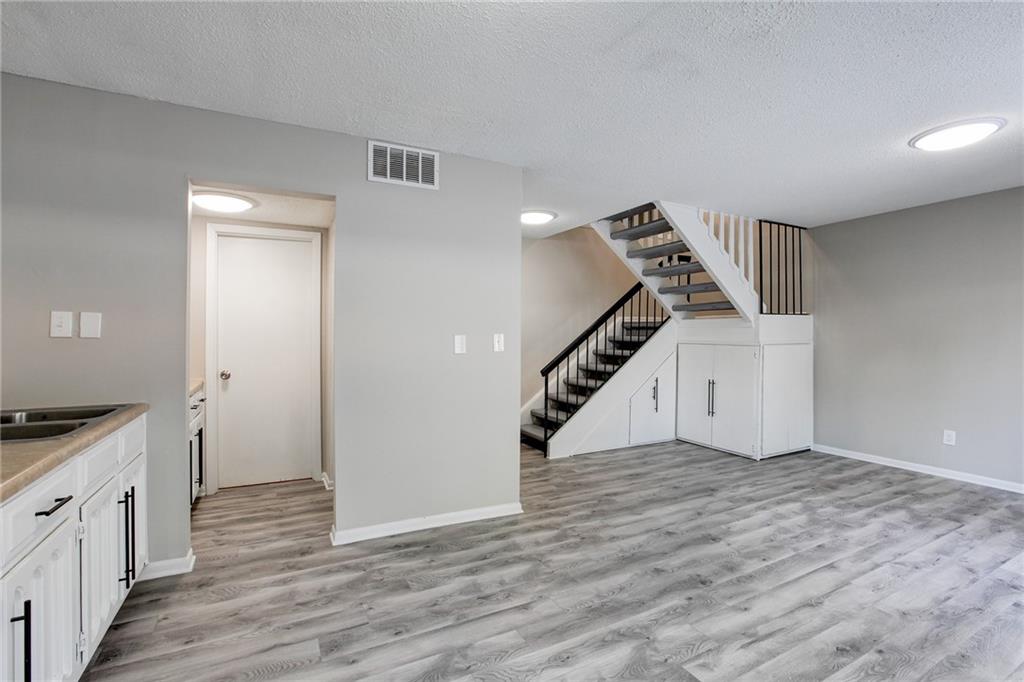 7325 Cardigan Circle Atlanta, GA 30328 - Photo 2 of 25 a view of an entryway with wooden floor