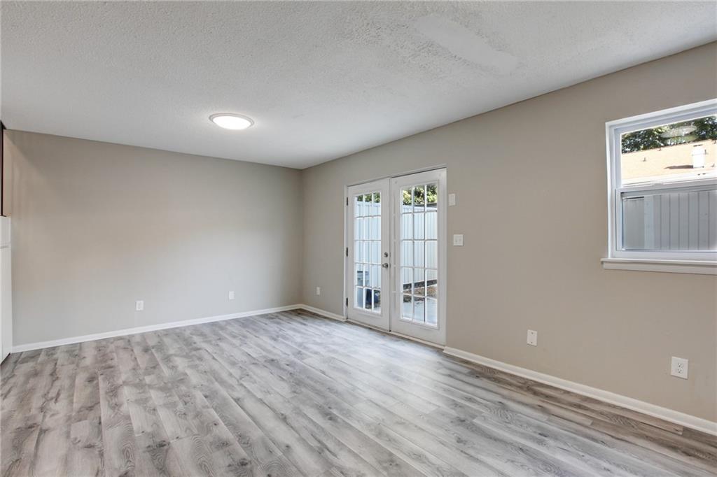 7325 Cardigan Circle Atlanta, GA 30328 - Photo 3 of 25 wooden floor in an empty room with a window