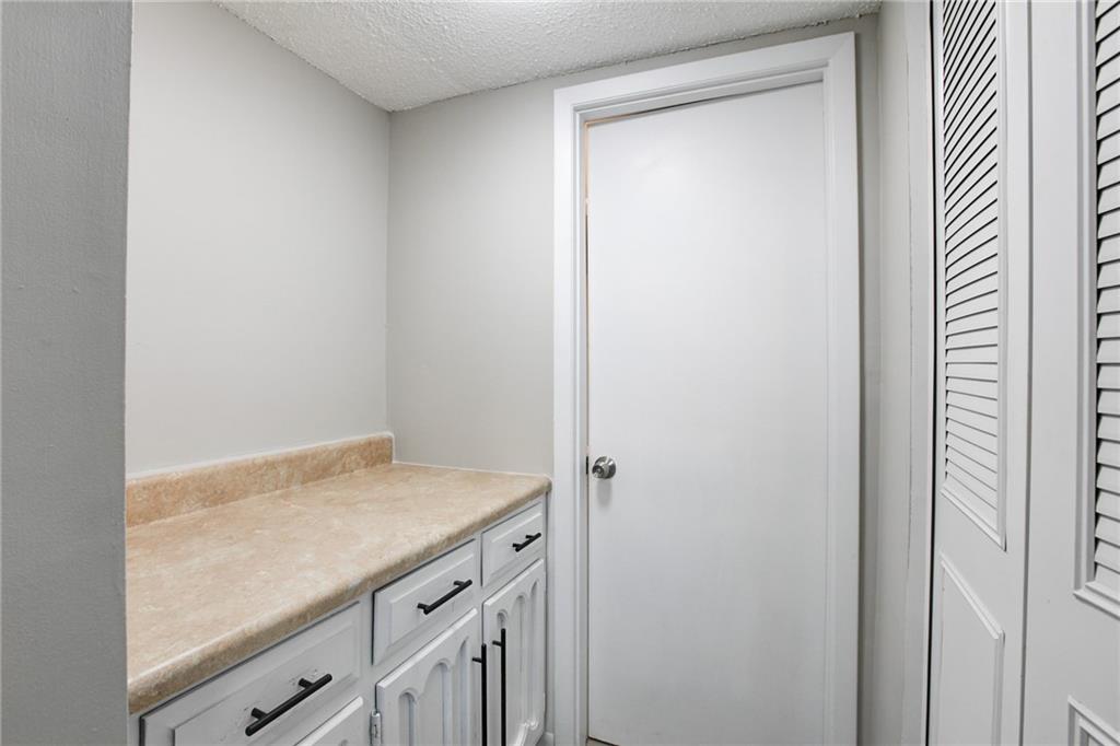 7325 Cardigan Circle Atlanta, GA 30328 - Photo 4 of 25 a view of a kitchen that has a sink and wooden floor