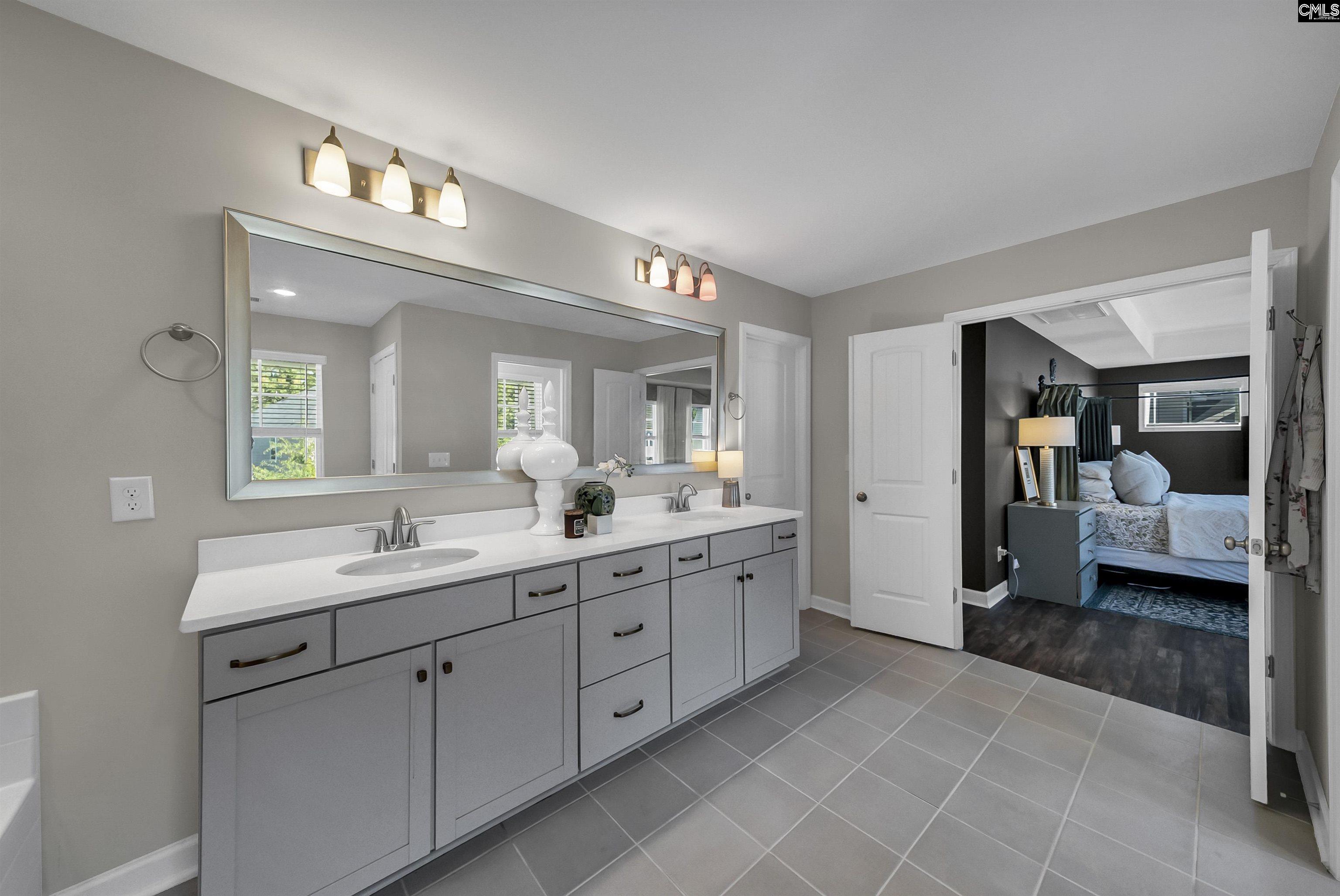 515 Malachite Lane Chapin, SC 29036 - Photo 29 of 63 a en suite bathroom with double sink and a mirror