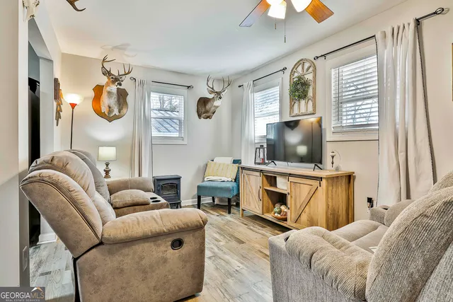 a living room with furniture and a flat screen tv