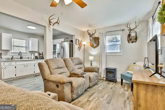 a living room with furniture and a table