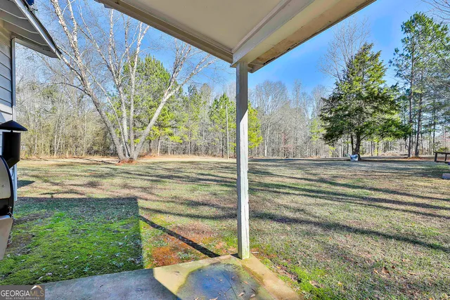a view of a parked car in front of a house