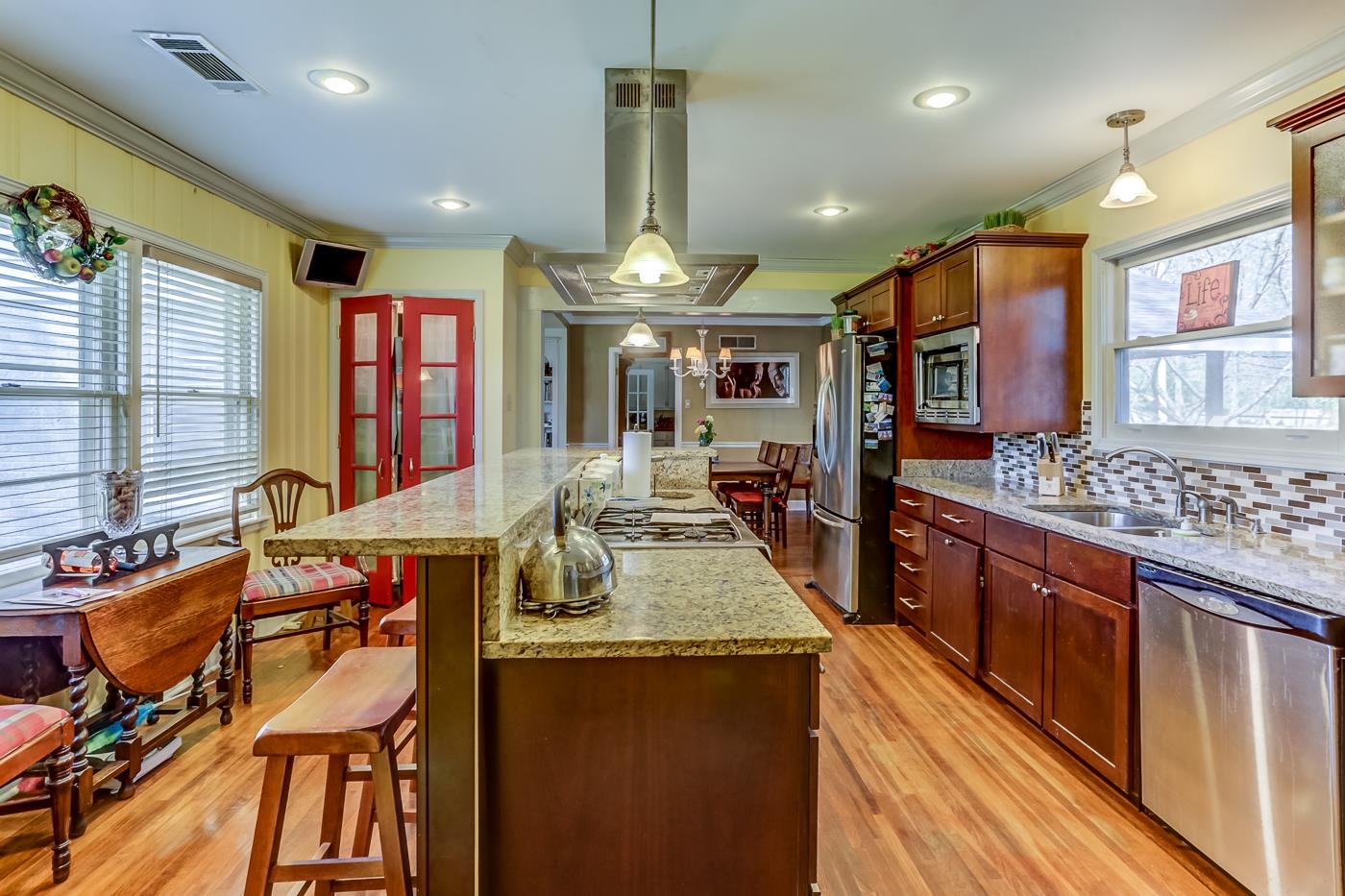 5126 Walnut Grove Road Memphis, TN 38117 - Photo 6 of 23 a kitchen with stainless steel appliances granite countertop sink stove top oven and cabinets