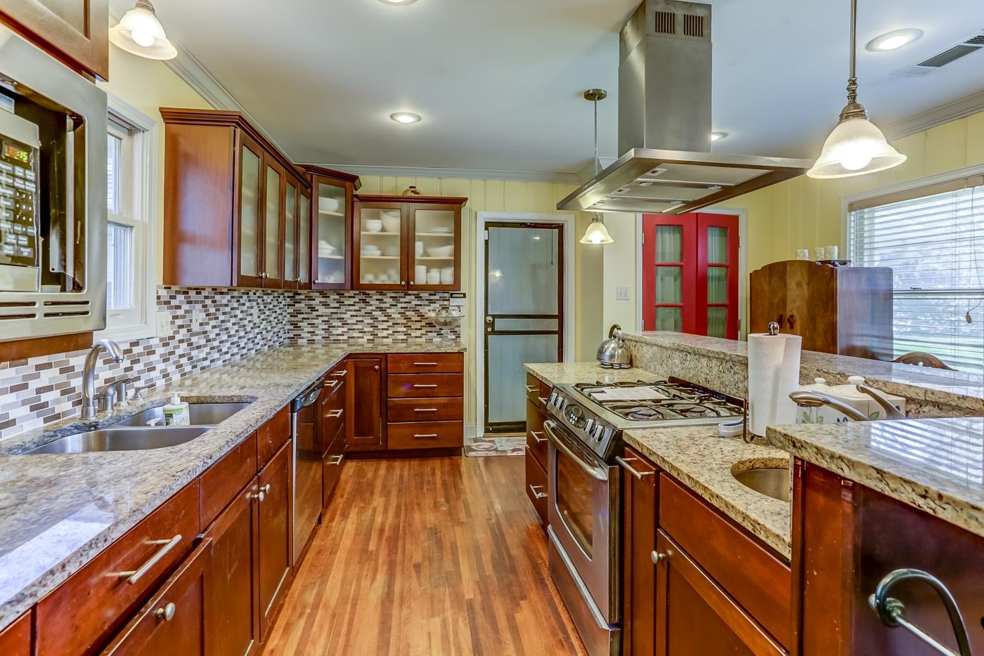 5126 Walnut Grove Road Memphis, TN 38117 - Photo 7 of 23 a kitchen with stainless steel appliances granite countertop a stove a sink and a microwave