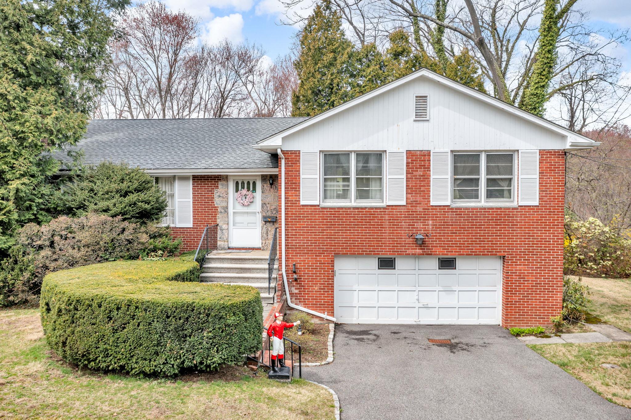 95 Wrexham Road Bronxville, NY 10708 - Photo 1 of 1 a front view of a house with a yard