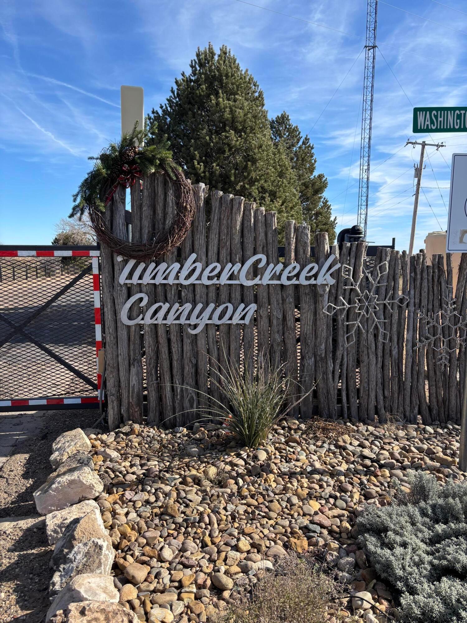 a view of outdoor space with wooden fence