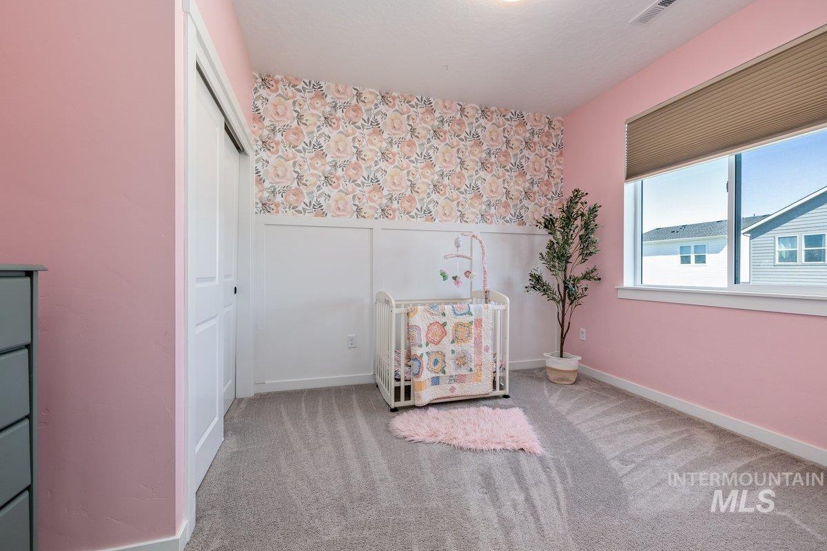 1380 West Chilitna Street Meridian, ID 83642 - Photo 32 of 50 Room featuring wall-to-wall carpeting, a large window with blinds, and white trim work