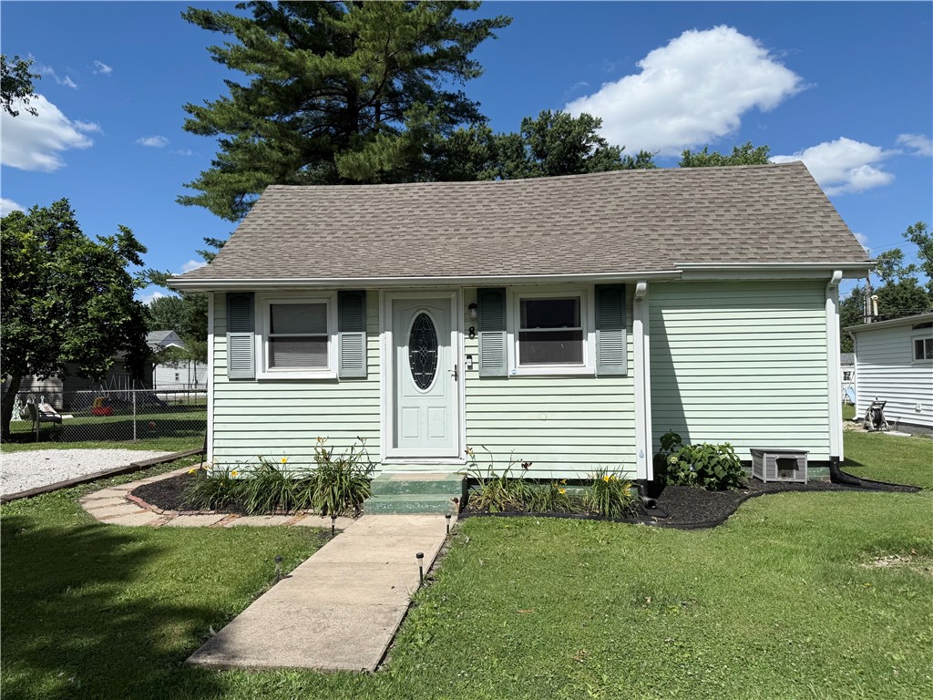 8 Chestnut Street Danville, IL 61832 - Photo 1 of 19 a front view of a house with a garden