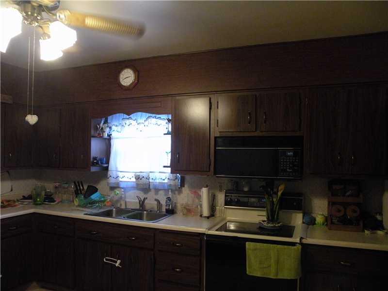 954 Armbrust Hecla Road Mount Pleasant, PA 15685 - Photo 12 of 25 Kitchen. Side 2 eat in kitchen with plenty of cabinet space Microwave, Refrigerator & Stove included in sale