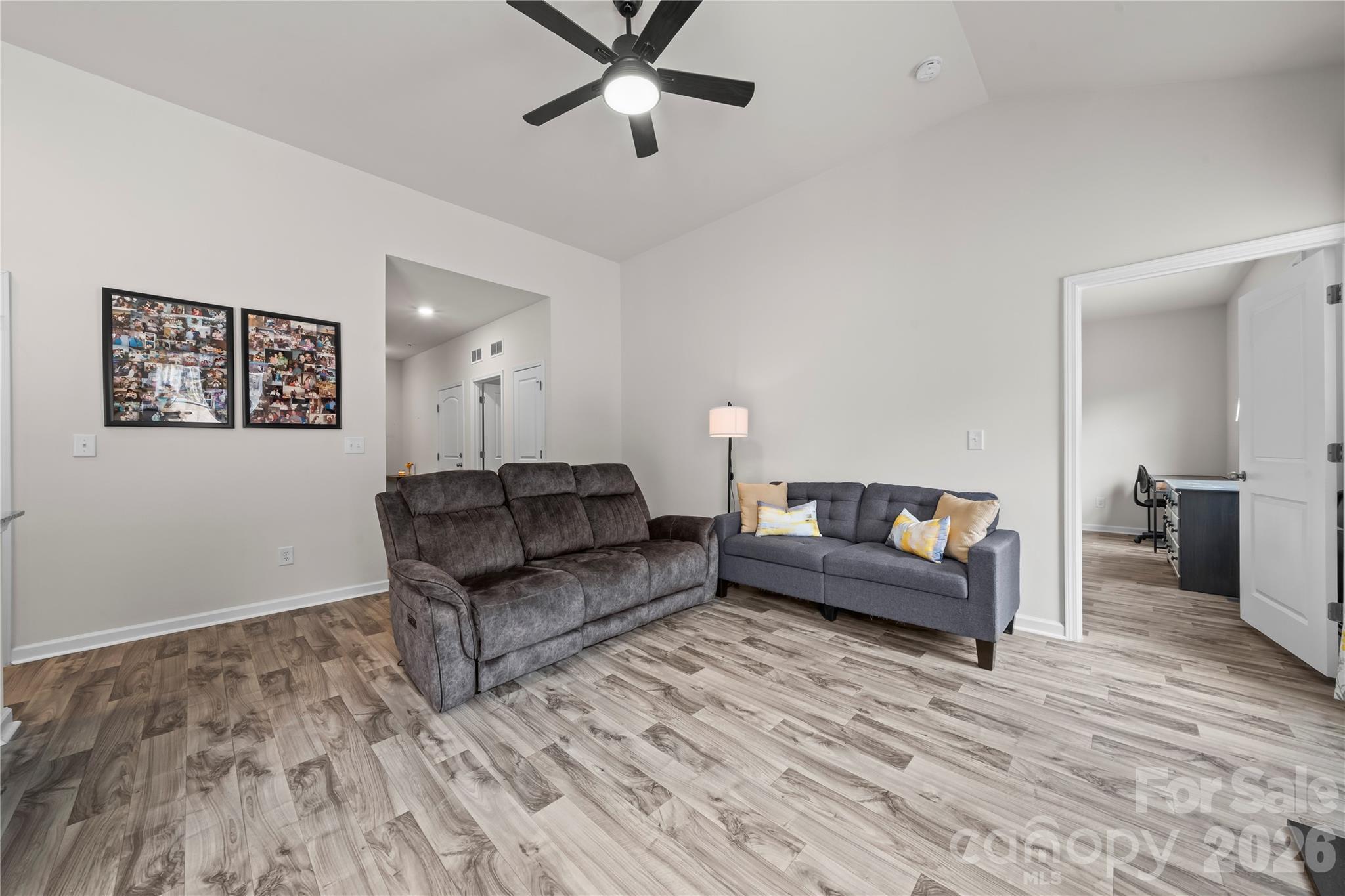 7380 Latham Way Denver, NC 28037 - Photo 12 of 39 a living room with furniture and a wooden floor