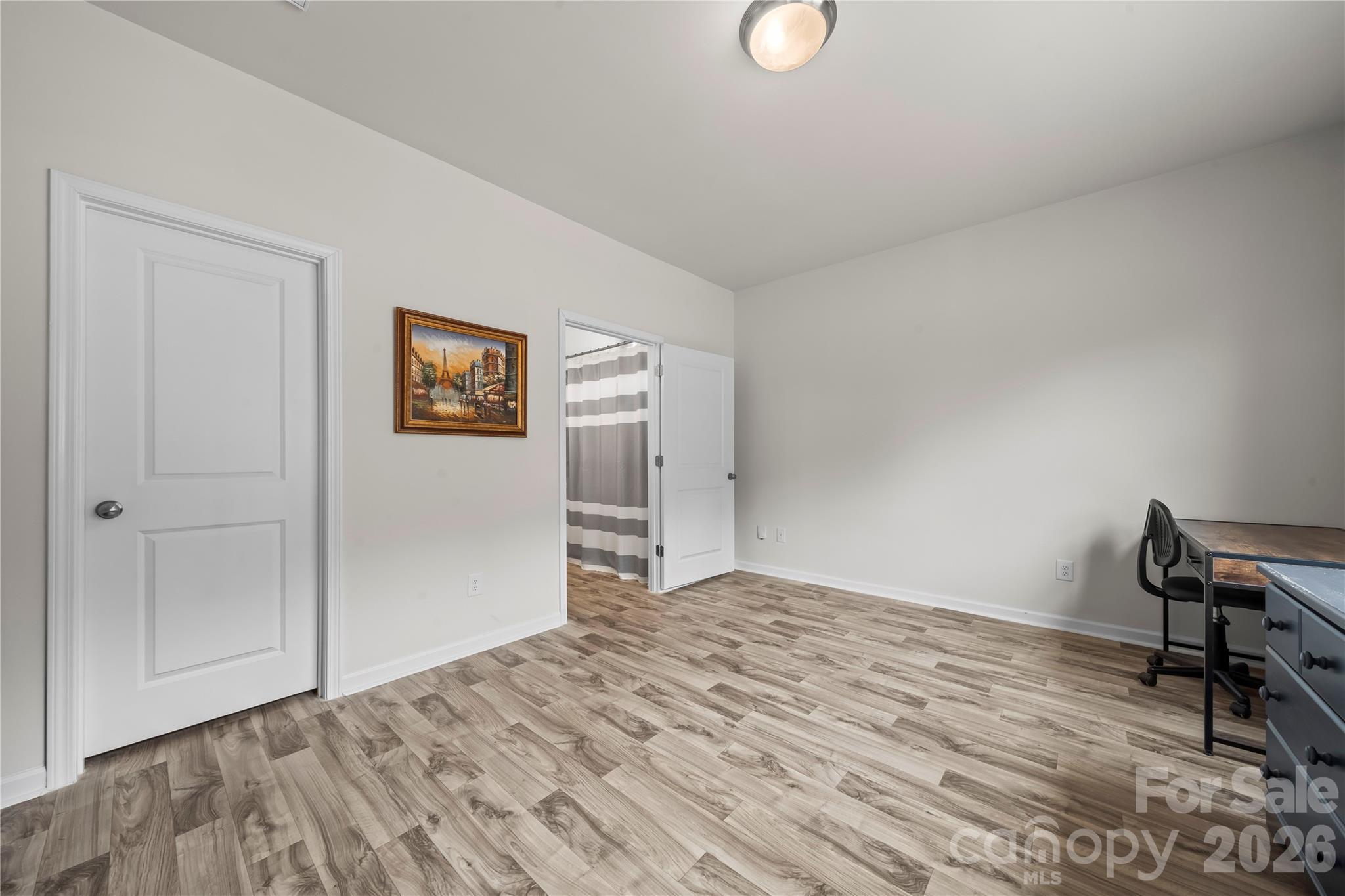 7380 Latham Way Denver, NC 28037 - Photo 16 of 39 a view of empty room with wooden floor
