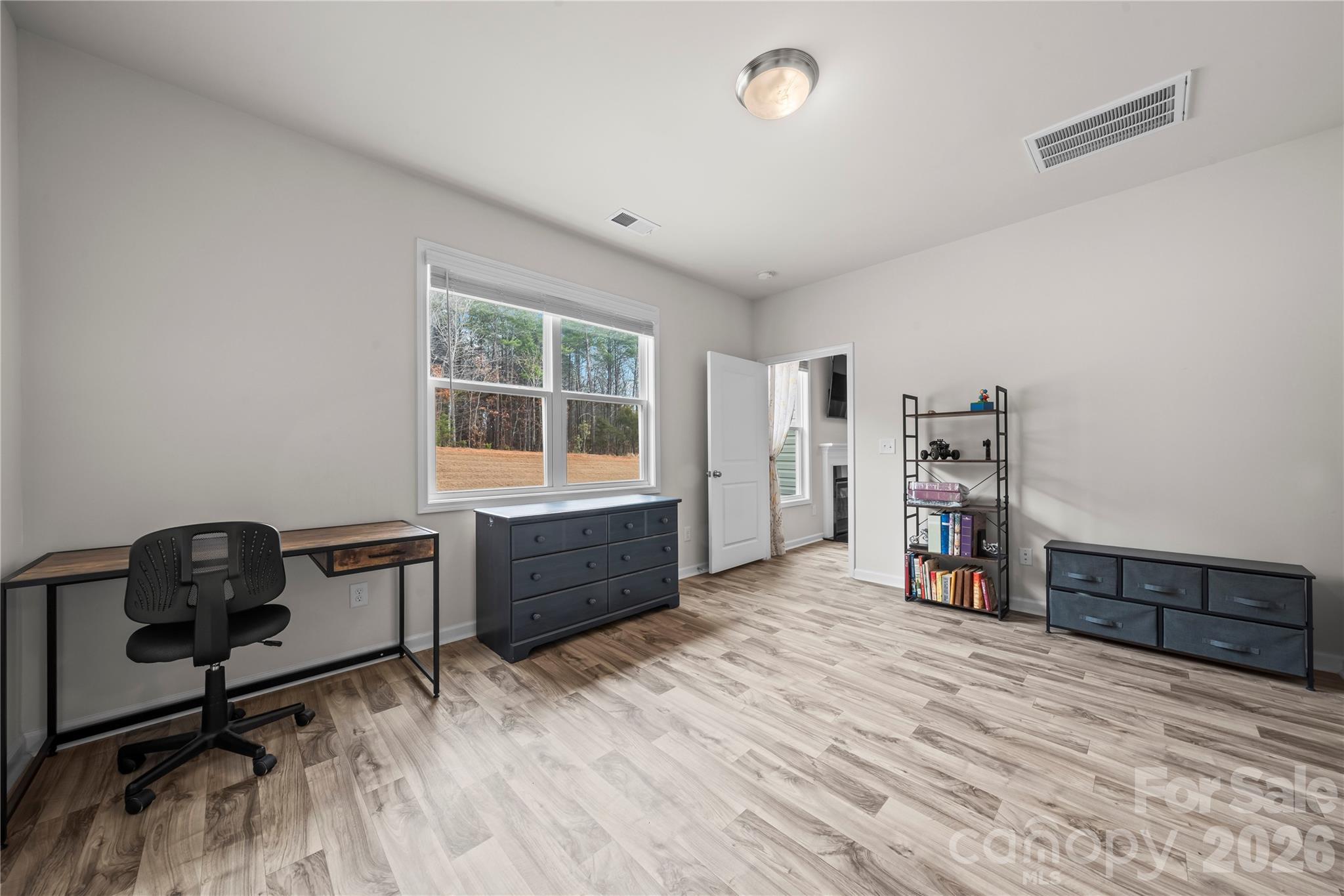 7380 Latham Way Denver, NC 28037 - Photo 17 of 39 a room with furniture and a wooden floor